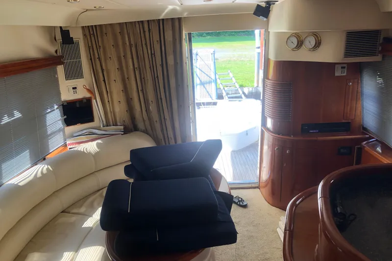 Slide: The Image of Interior of 2002 Birchwood Challenger 460 Flybridge yacht with elegant seating and wood finishes. - 72
