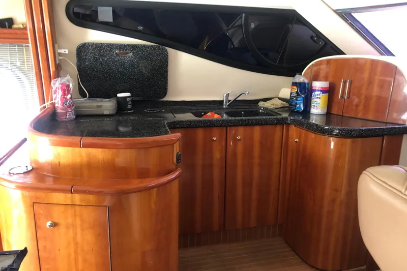 Slide: The Image of Luxurious 2002 Birchwood Challenger 460 Flybridge yacht interior with sleek wooden cabinetry. - 75