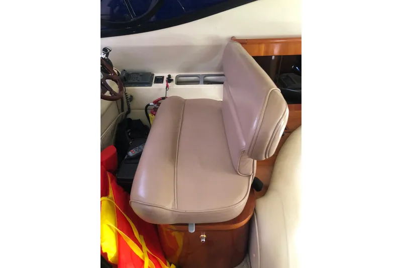 Slide: The Image of Beige leather seat in 2002 Birchwood Challenger 460 Flybridge boat interior. - 80