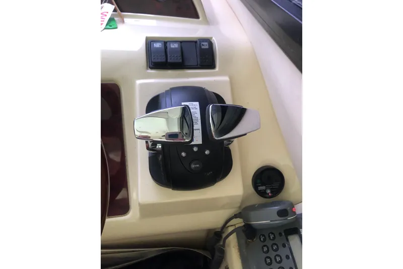 Slide: The Image of Control panel of 2002 Birchwood Challenger 460 Flybridge with throttle and switches. - 88