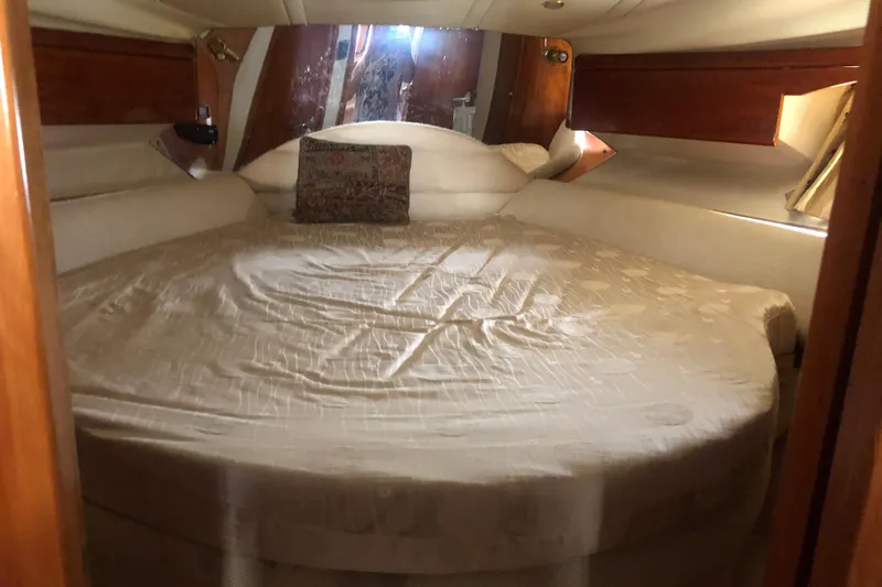 Slide: The Image of Cozy bedroom in 2002 Birchwood Challenger 460 Flybridge yacht with round bed. - 92