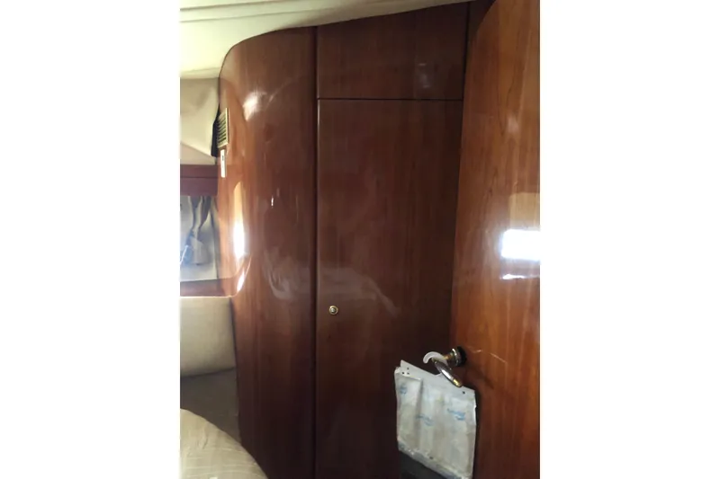 Slide: The Image of Interior view of 2002 Birchwood Challenger 460 Flybridge with polished wooden paneling. - 93