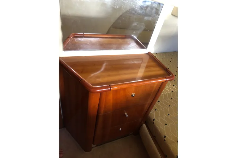 Slide: The Image of Wooden dresser with mirror on Birchwood Challenger 460 Flybridge, 2002 model. - 98