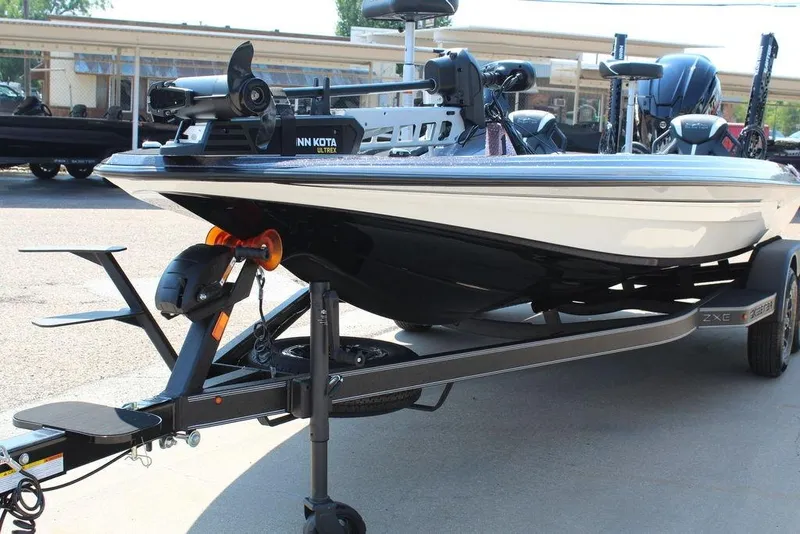 Slide: The Image of 2026 Skeeter ZXE20 boat on trailer with Minn Kota Ultrex motor. - 13