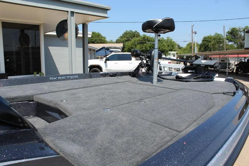 Slide: The Image of 2026 Skeeter ZXE20 boat with spacious deck and modern design in outdoor setting. - 20