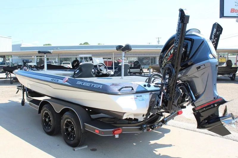 Slide: The Image of 2026 Skeeter ZXE20 boat with powerful outboard motor on a trailer. - 7