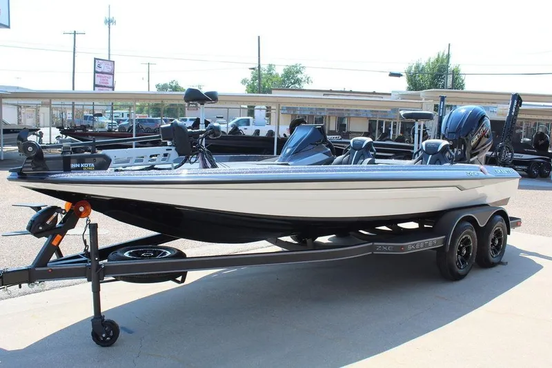 Slide: The Image of 2026 Skeeter ZXE20 fishing boat on trailer, featuring Minn Kota trolling motor. - 9