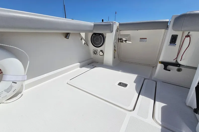 Slide: The Image of 2006 Tiara 3200 Open boat deck with storage hatch and safety equipment. - 12