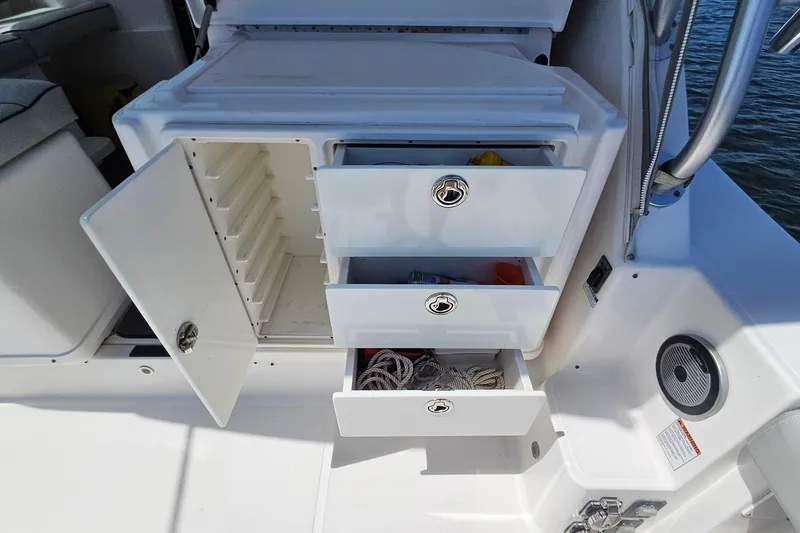 Slide: The Image of 2006 Tiara 3200 Open boat storage with open drawers and compartments. - 16