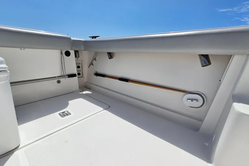 Slide: The Image of 2006 Tiara 3200 Open boat interior with rod holder and storage compartment. - 18