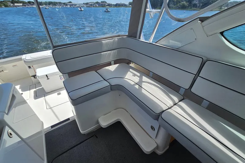 Slide: The Image of 2006 Tiara 3200 Open boat interior with cushioned seating and scenic water view. - 20