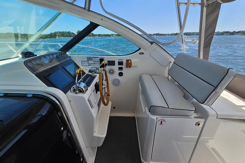 Slide: The Image of Interior view of 2006 Tiara 3200 Open yacht cockpit with steering wheel and seating. - 23