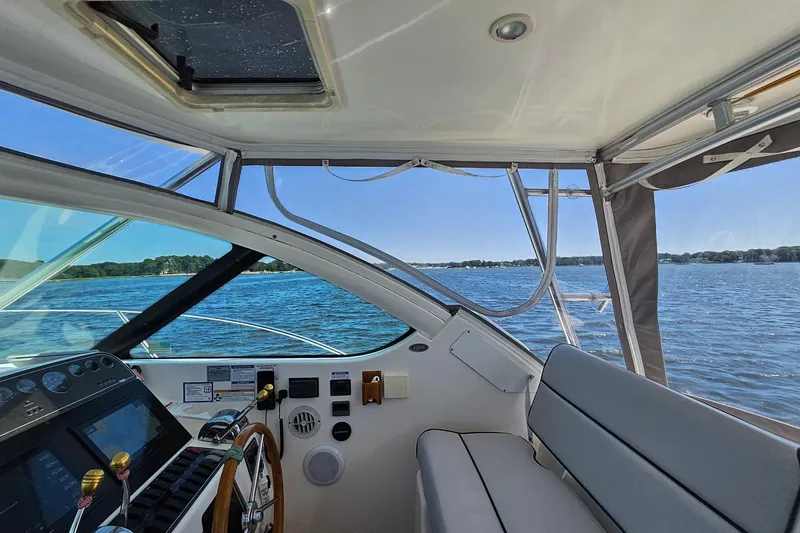 Slide: The Image of Interior view of 2006 Tiara 3200 Open yacht with scenic water backdrop. - 24