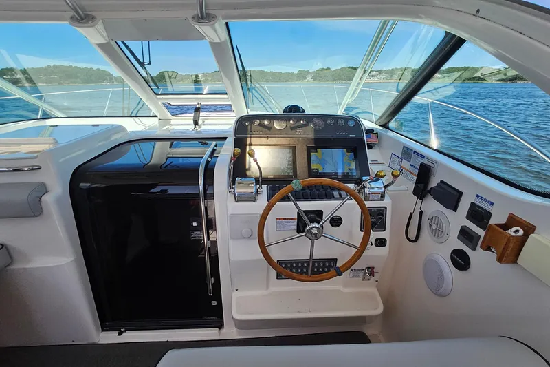 Slide: The Image of Helm of 2006 Tiara 3200 Open boat with navigation equipment and steering wheel. - 25