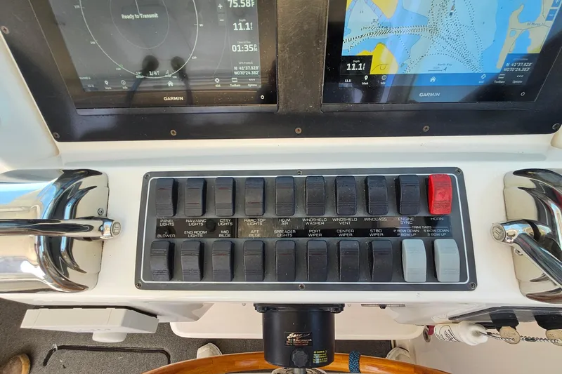 Slide: The Image of Control panel of a 2006 Tiara 3200 Open boat with navigation screens. - 27
