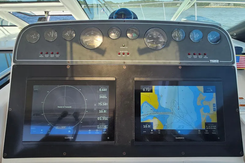 Slide: The Image of Dashboard of a 2006 Tiara 3200 Open boat with Garmin navigation displays. - 28