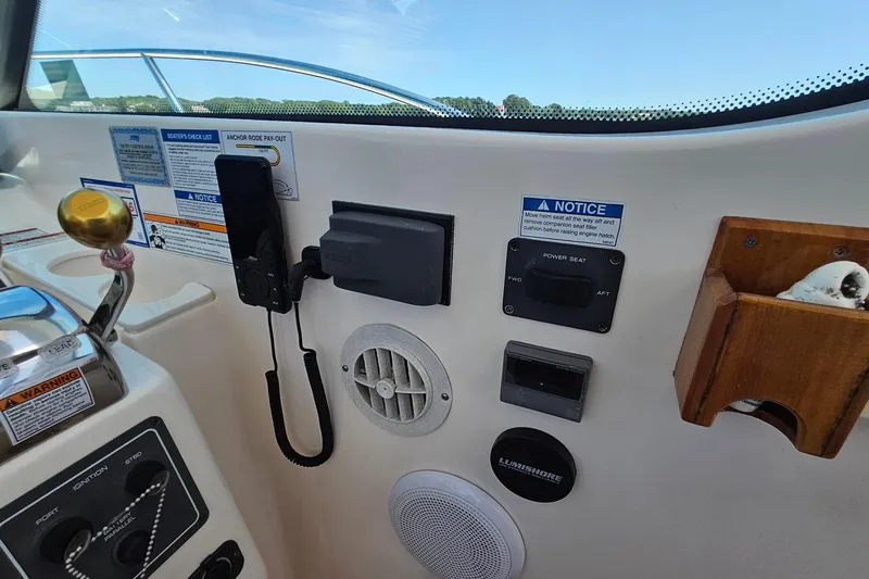 Slide: The Image of Control panel of a 2006 Tiara 3200 Open boat with various switches and notices. - 29