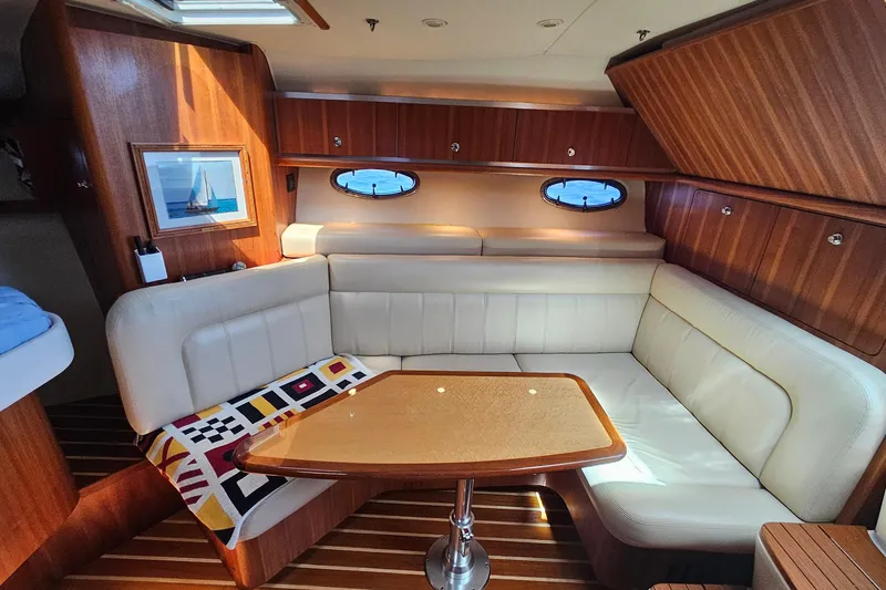 Slide: The Image of Luxurious interior of 2006 Tiara 3200 Open yacht with elegant seating and wooden finishes. - 31