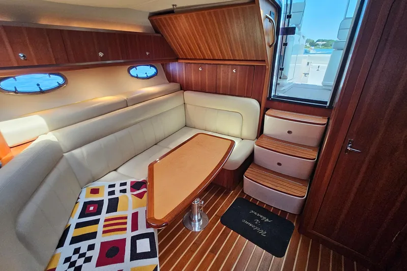 Slide: The Image of Luxurious 2006 Tiara 3200 Open yacht interior with elegant seating and wooden accents. - 32