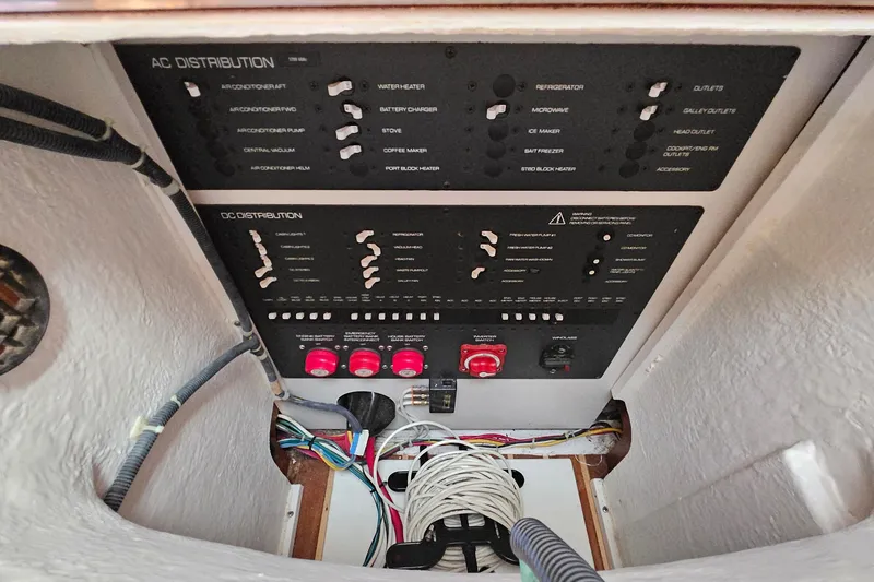 Slide: The Image of Electrical panel of a 2006 Tiara 3200 Open boat, showing AC and DC distribution. - 42