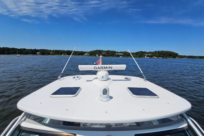 Slide: The Image of 2006 Tiara 3200 Open yacht with Garmin equipment on a serene lake. - 47