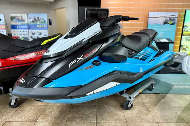Slide: The Image of 2025 Yamaha WaveRunner FX SVHO in showroom, featuring sleek blue and black design. - 10