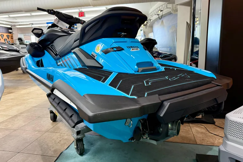 Slide: The Image of 2025 Yamaha WaveRunner FX SVHO in showroom, vibrant blue color, rear view. - 3