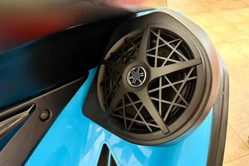 Slide: The Image of 2025 Yamaha WaveRunner FX SVHO speaker detail on blue watercraft. - 8