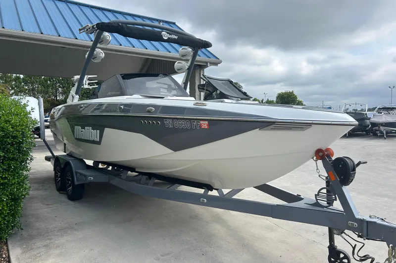 Slide: The Image of 2022 Malibu Wakesetter 23 LSV boat on trailer, parked outdoors. - 2