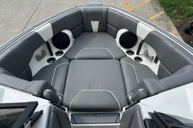 Slide: The Image of 2022 Malibu Wakesetter 23 LSV interior with gray seating and cup holders. - 21