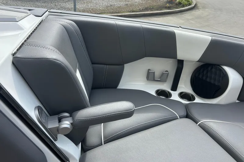 Slide: The Image of 2022 Malibu Wakesetter 23 LSV interior with gray leather seats and cup holders. - 22