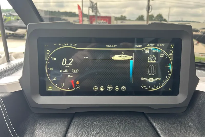 Slide: The Image of 2022 Malibu Wakesetter 23 LSV dashboard display showing speed, ballast, and surf settings. - 26