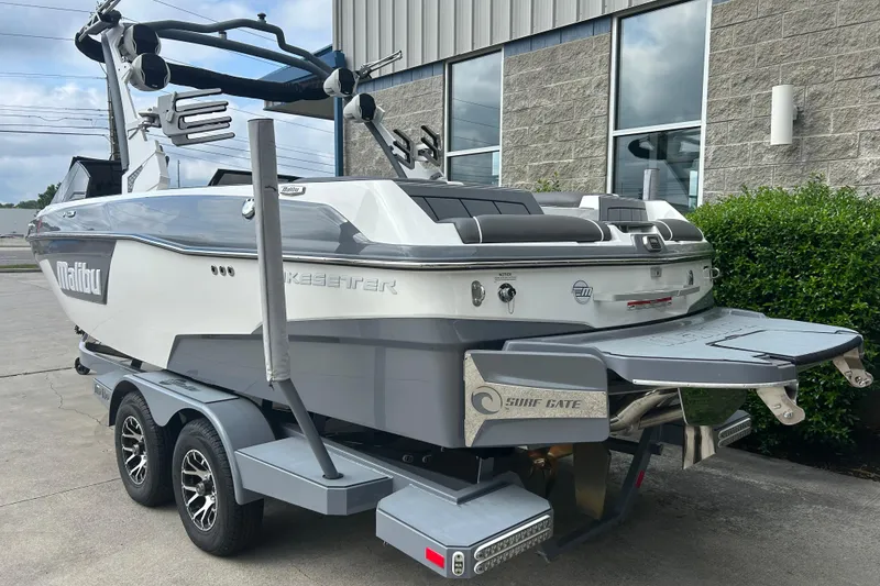 Slide: The Image of 2022 Malibu Wakesetter 23 LSV boat on trailer, rear view, parked outdoors. - 4