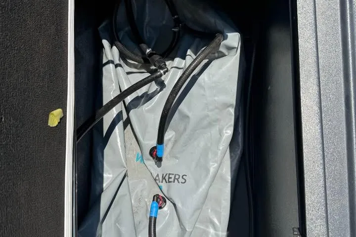 Slide: The Image of Ballast bag with hoses in 2011 Axis A20 boat compartment. - 10