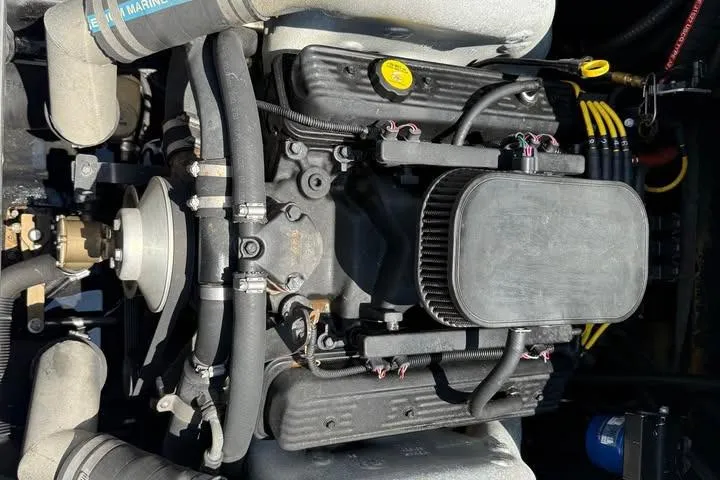 Slide: The Image of 2011 Axis A20 engine with visible hoses and components, showcasing marine engineering. - 12