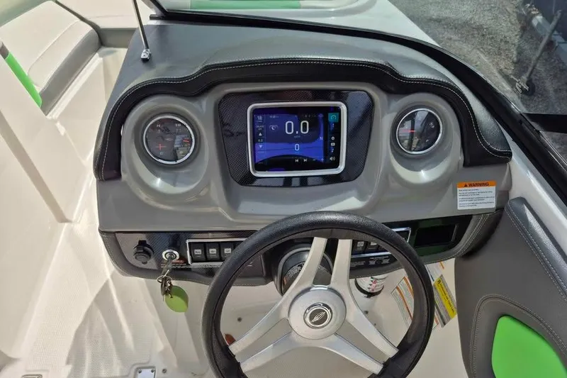 Slide: The Image of 2017 Chaparral Vortex 203 VRX dashboard with steering wheel and digital display. - 10