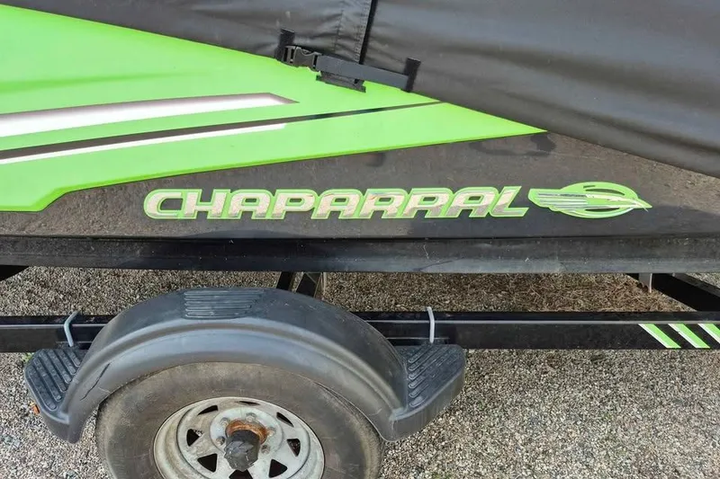 Slide: The Image of 2017 Chaparral Vortex 203 VRX boat trailer with green and black design. - 11