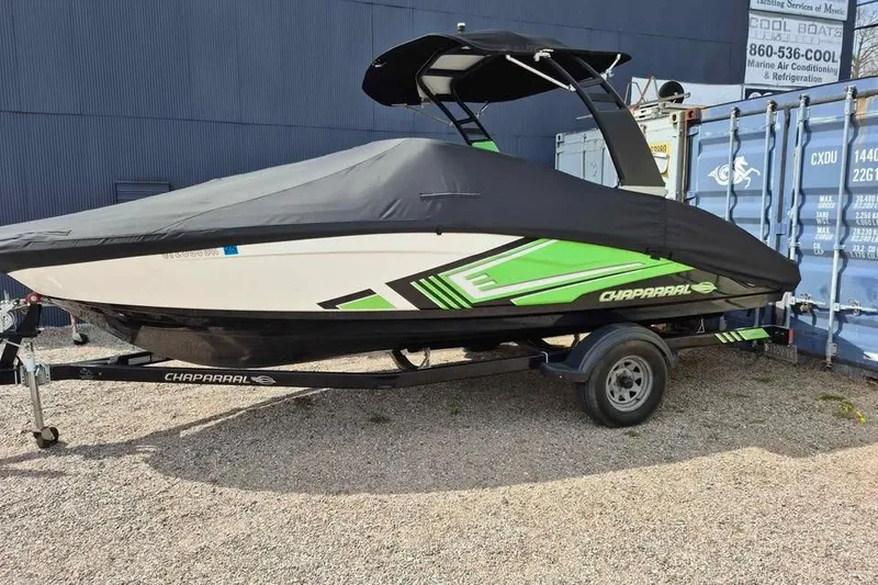 Slide: The Image of 2017 Chaparral Vortex 203 VRX boat with cover, parked on trailer. - 2