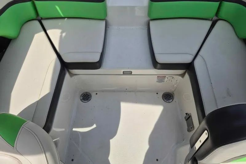 Slide: The Image of 2017 Chaparral Vortex 203 VRX boat interior with green and white seating. - 7