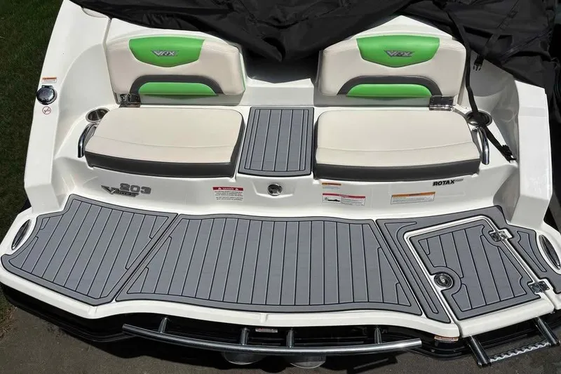 Slide: The Image of 2017 Chaparral Vortex 203 VRX boat with gray deck and green-accented seats. - 8