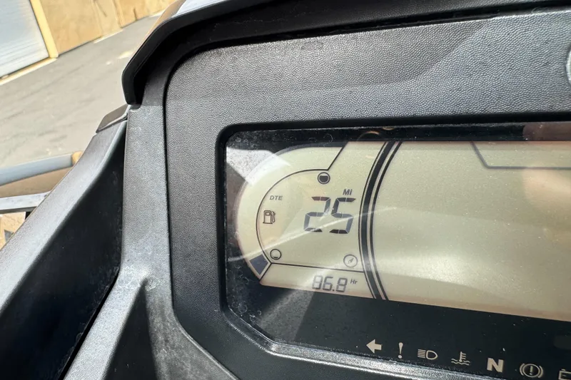 Slide: The Image of Dashboard of a 2021 Sea-Doo RXT-X 300 showing 25 miles distance to empty. - 14
