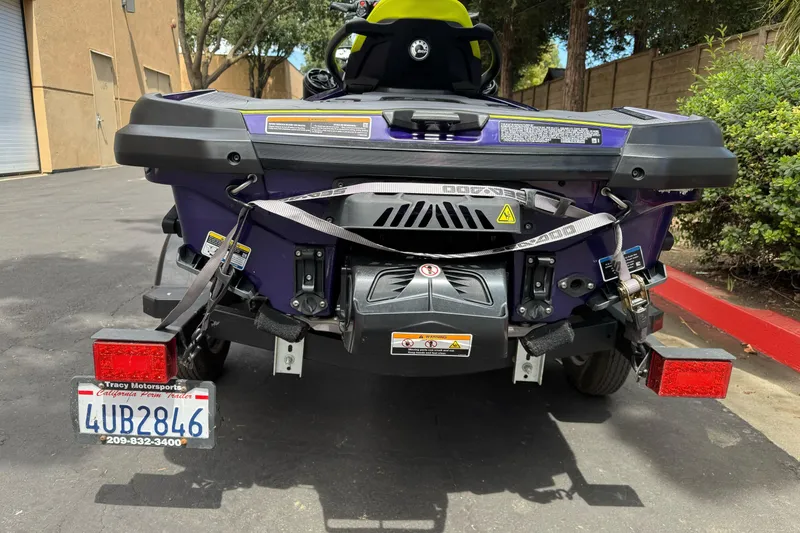 Slide: The Image of 2021 Sea-Doo RXT-X 300 on trailer, rear view, parked outdoors. - 9