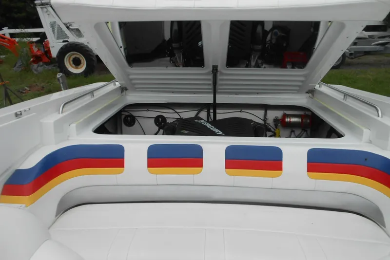 Slide: The Image of 2003 Formula 271 FASTech boat engine compartment with colorful seat accents. - 12