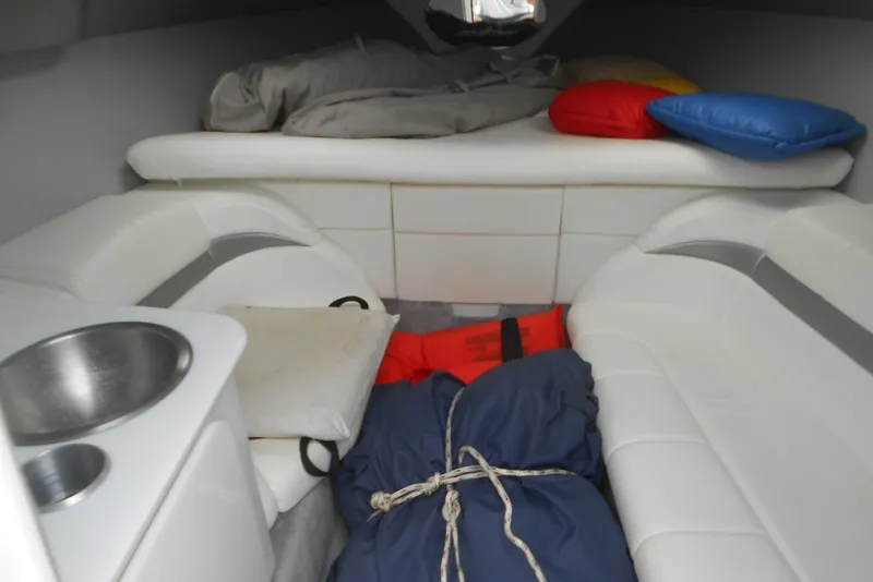 Slide: The Image of Interior cabin of 2003 Formula 271 FASTech boat with cushions and storage. - 13