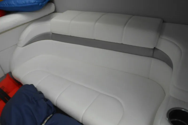 Slide: The Image of Interior seating of 2003 Formula 271 FASTech boat, featuring white cushioned upholstery. - 15