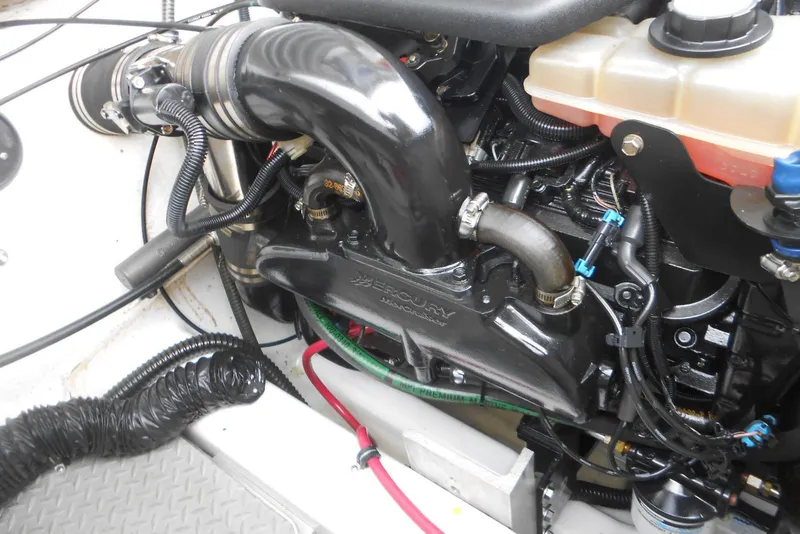 Slide: The Image of Engine compartment of a 2003 Formula 271 FASTech boat, featuring Mercury components. - 17