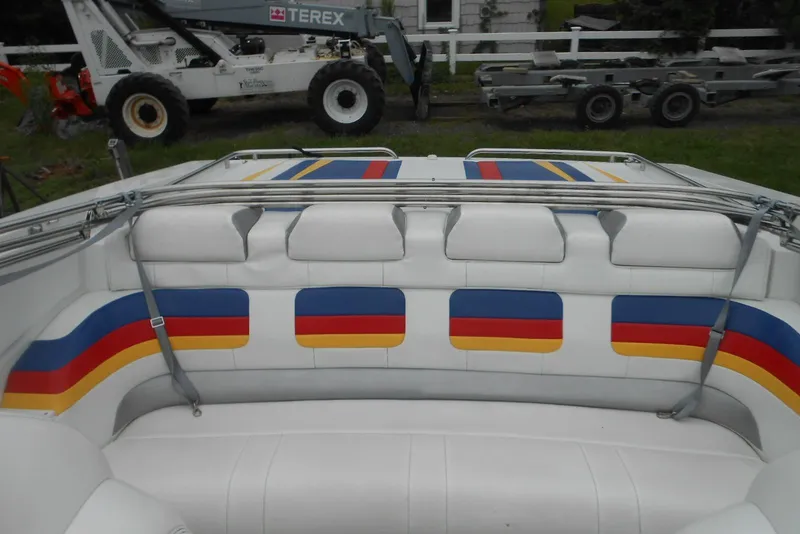 Slide: The Image of 2003 Formula 271 FASTech boat interior with colorful striped seating design. - 4