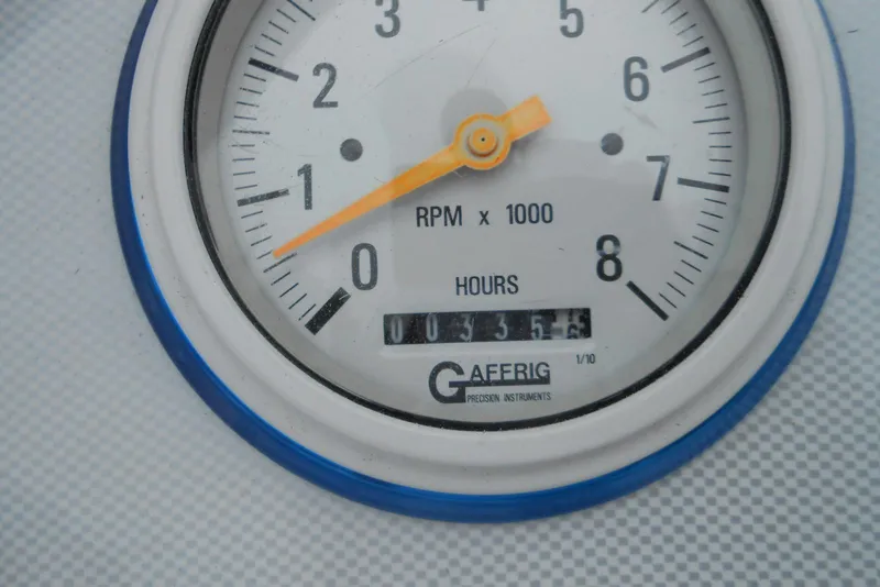 Slide: The Image of Close-up of a 2003 Formula 271 FASTech tachometer showing RPM and hours. - 9