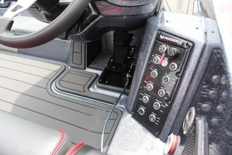 Slide: The Image of Interior view of 2026 Phoenix 21 XE boat dashboard with control panel and steering wheel. - 16
