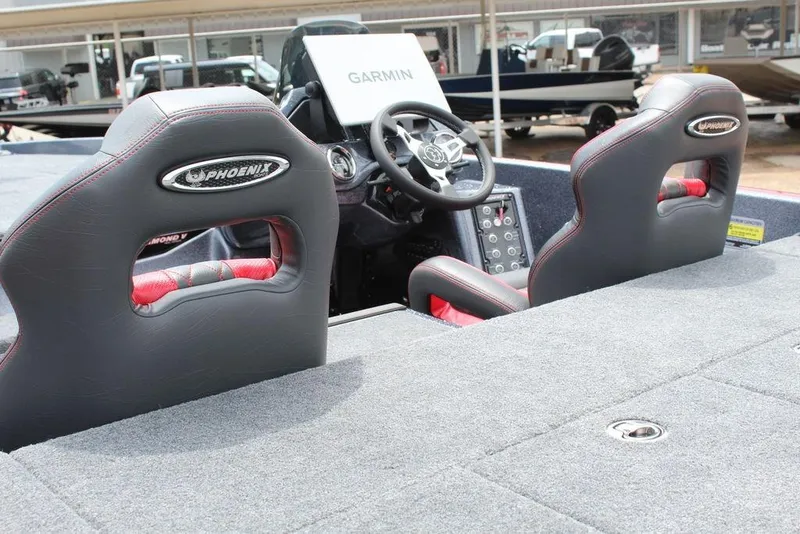 Slide: The Image of Interior of 2026 Phoenix 21 XE boat with Garmin navigation system and plush seating. - 17